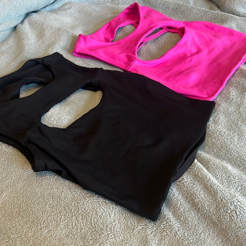 Two fitted gym crop tops with criss cross back. Size xs-small.